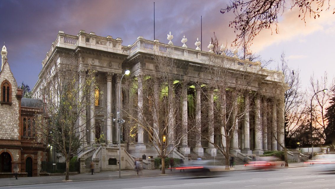 South Australian Government offices pictured under a purple-grey sky.